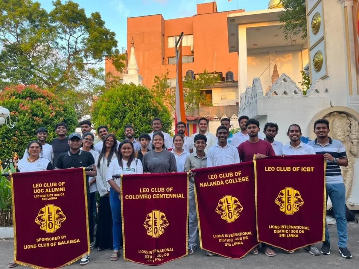 Leos from several clubs holding their banners outside the temple